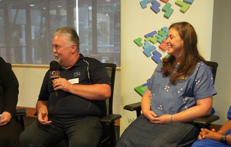 Four people sitting and talking
