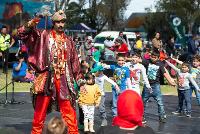 Kids having fun with a street performer