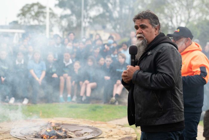 an Aboriginal man speaking at a smoking ceremony