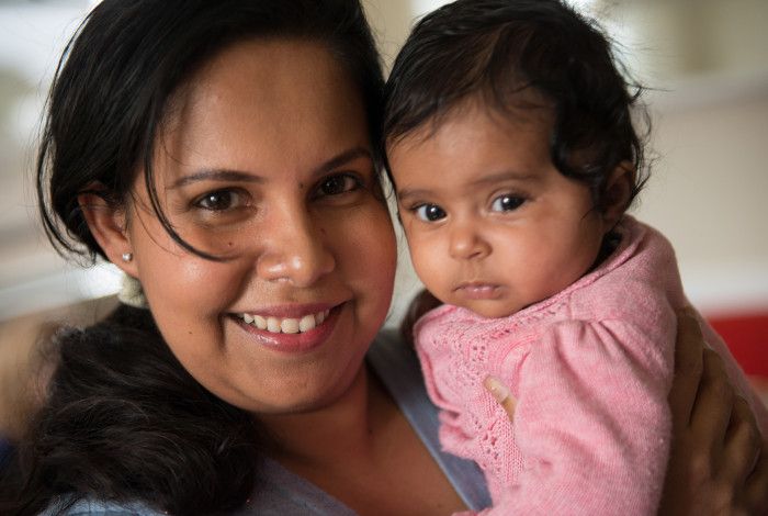 Mum and baby smiling