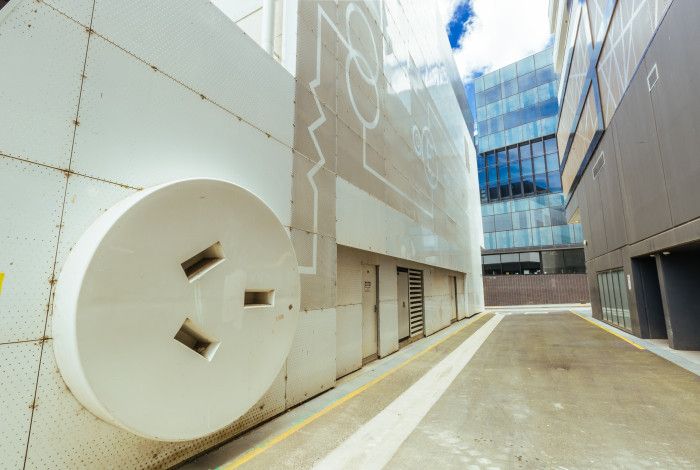 Outside of building with a large artistic power point.