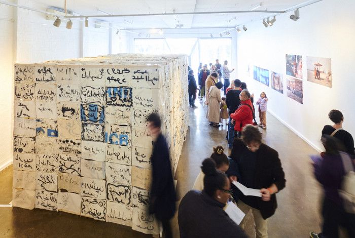 People looking at an art exhibition in an art gallery