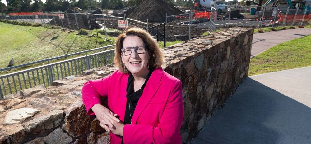 Councillor Rhonda Garad leaning against a brick wall