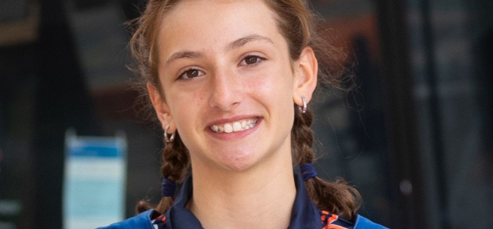 junior may in robes with medal