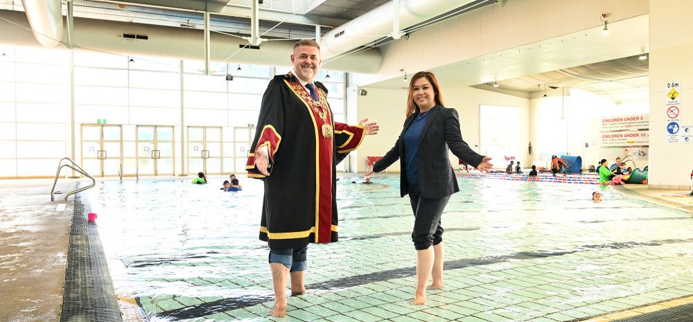 Mayor Cr Jim Memeti and Deputy Mayor Cr Sophie Tan in a swimming pool