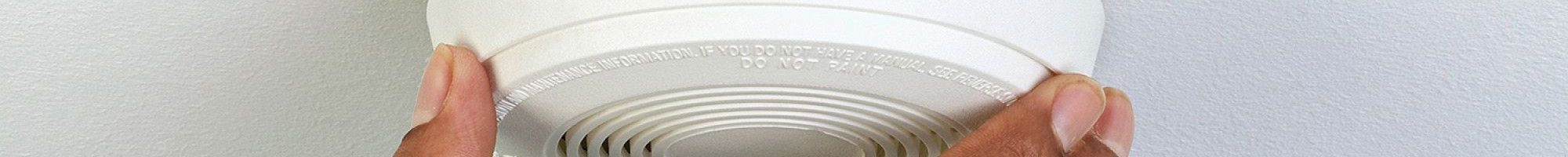 Smoke alarm being installed