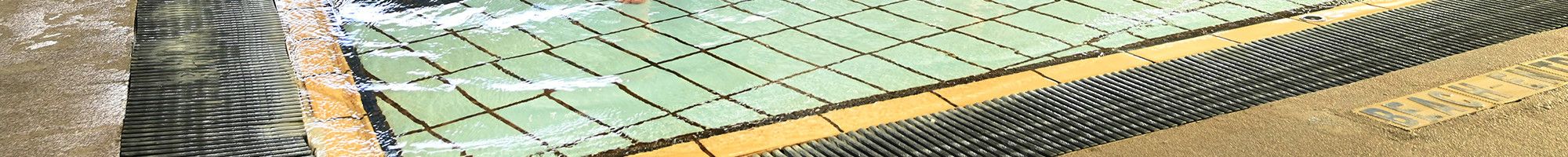 Mayor Cr Jim Memeti and Deputy Mayor Cr Sophie Tan in a swimming pool