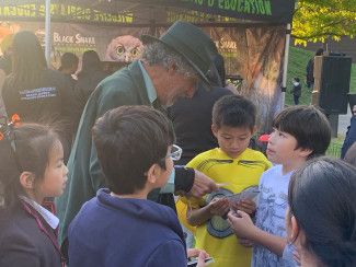 A roving performer at Halloween in the Park 2023