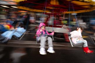Children enjoying an amusement ride